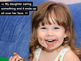 My daughter eating something and it ends up all over her face.